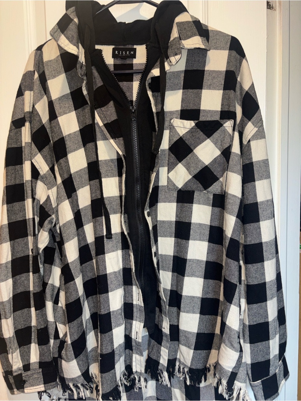 RISEN BLACK AND WHITE PLAID FLANNEL WITH ZIPPER AND BUTTON CLOSURE HOOD AS WELL